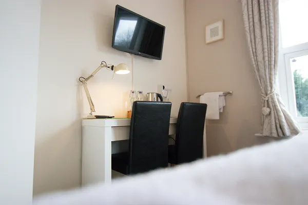 Desk with lamp and TV